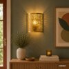 Brilliant Leuchten Aplique de pared Molly dorado con pantalla metálica calada de hojas