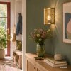 Brilliant Leuchten Aplique de pared Molly dorado con pantalla metálica calada de hojas
